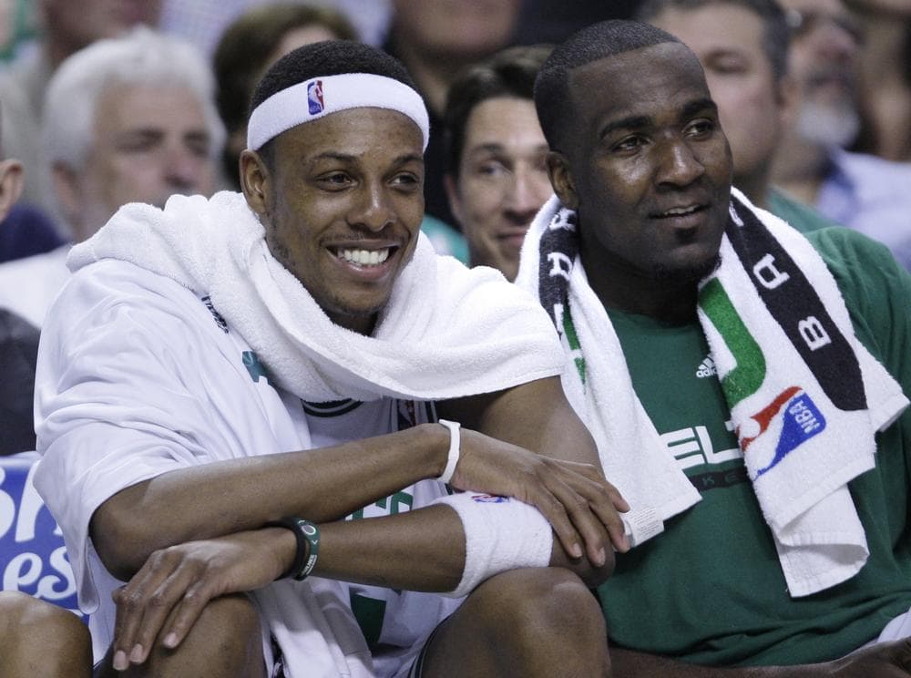 Paul Pierce smiles as he watches the end of the fourth quarter with teammate Kendrick Perkins. .(AP Photo/Charles Krupa)