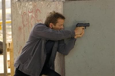 Kiefer Sutherland as agent Jack Bauer draws his gun in a scene from Fox&#039;s &quot;24,&quot; in this undated publicity photo. (AP)