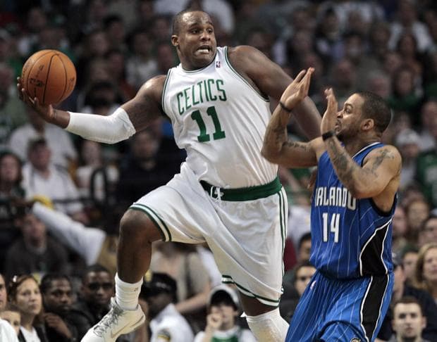 Boston forward Glen Davis saves the ball from going out of bounds as Orlando guard Jameer Nelson reacts during the first half of Game 3 of the NBA Eastern Conference finals in Boston on Saturday. (AP)