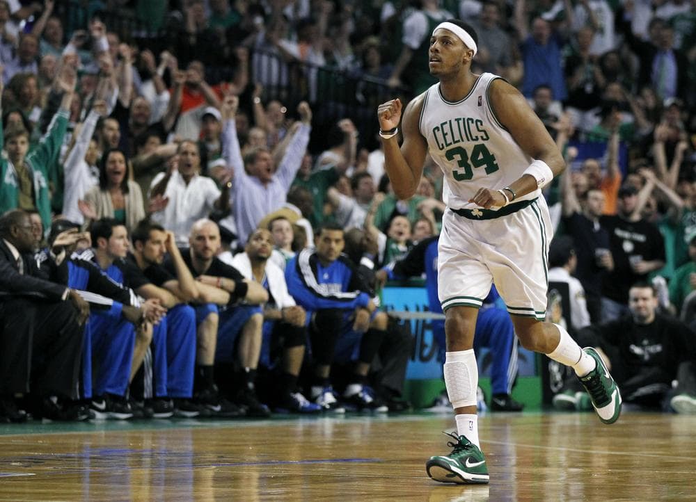 Paul Pierce celebrates a three-point basket as he runs past the Orlando Magic bench during the fourth quarter in Game 6 of the NBA Eastern Conference basketball finals. (AP Photo/Charles Krupa)