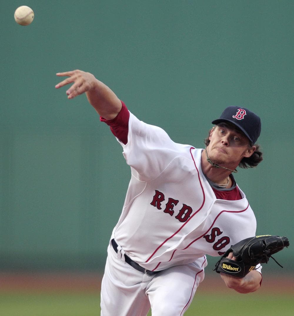 Clay Buchholz pitches in the first inning of a baseball game against the Kansas City Royals, Saturday. (AP Photo/Michael Dwyer)