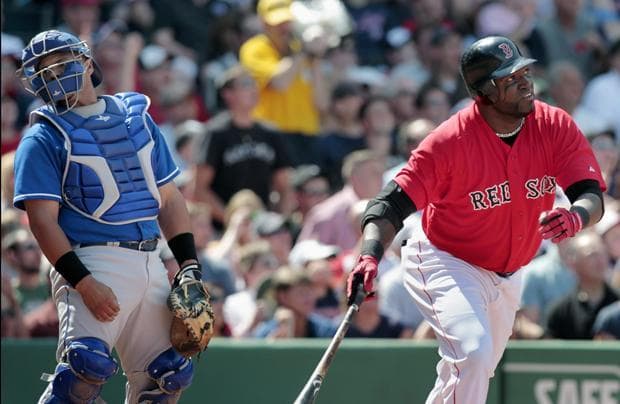 Kansas City's Brayan Pena looks away as Boston's David Ortiz watches his two-run home run in the fifth inning of the game on Sunday in Boston. (AP)