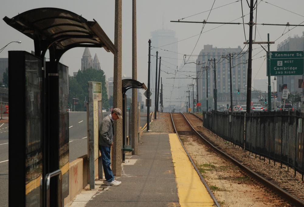 Smoky haze has cut visibility in Boston. Here, the Boston skyline is barely discernable behind the Boston University West MBTA stop on Commonwealth Avenue. (Jess Bidgood for WBUR)