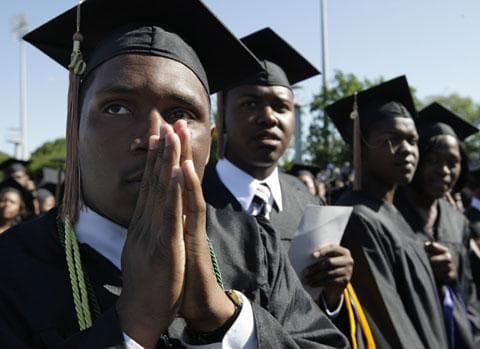 Ryan Brown of Deptford, N.J., and other seniors wait in anticipation for President Barack Obama to address the graduates of Hampton University, Sunday, May 9, 2010. (AP)