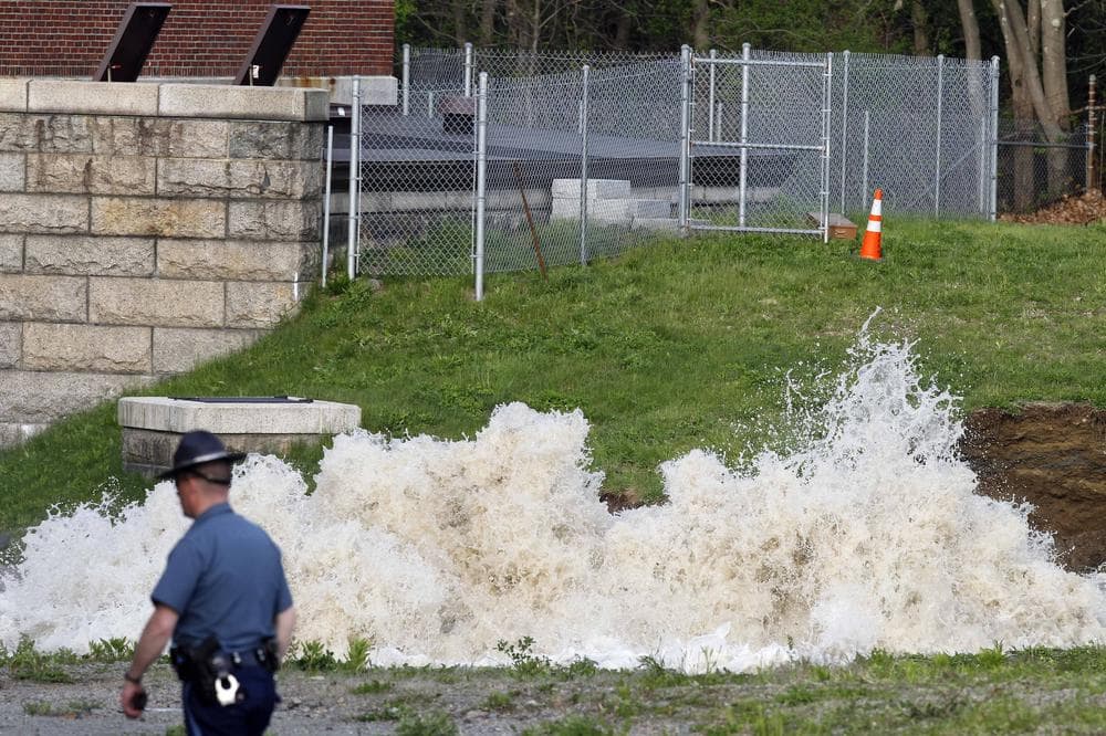 Water surges from the ground at the site of a water main break, Saturday, May 1, 2010, in Weston, Mass. Water to 2 million people in Boston and more than two dozen suburbs is temporarily unsuitable for drinking after the break in a pipe that connects a major suburban reservoir to the city. (AP)