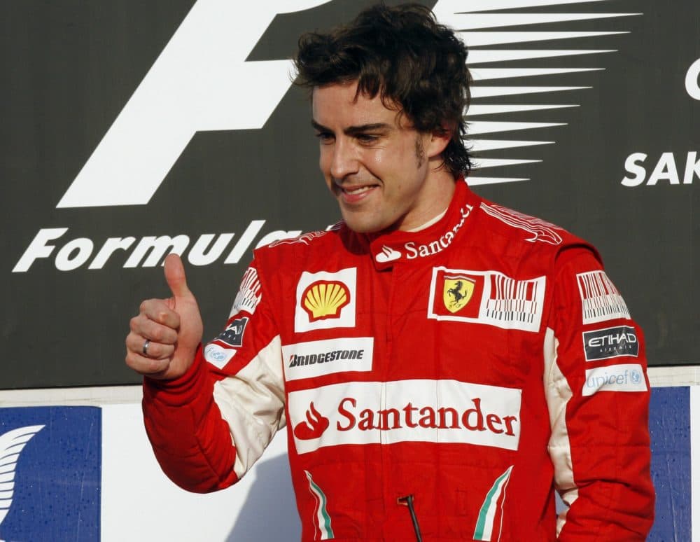 Fernando Alonso shows off his valuable thumb after winning the Formula One Bahrain Grand Prix, in Sakhir, Bahrain, in March. (AP Photo)