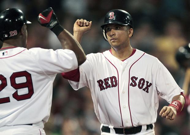 Boston's Victor Martinez celebrates with Adrian Beltre after scoring on a single by Kevin Youkilis in the eighth inning of a the game against Oakland on Tuesday in Boston. Boston won 9-4. (AP)