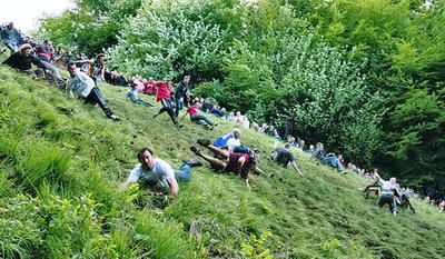 Revelers tumble down Cooper&#39;s Hill in Gloucester, England during the 2006 race. (mike warren/Flickr)