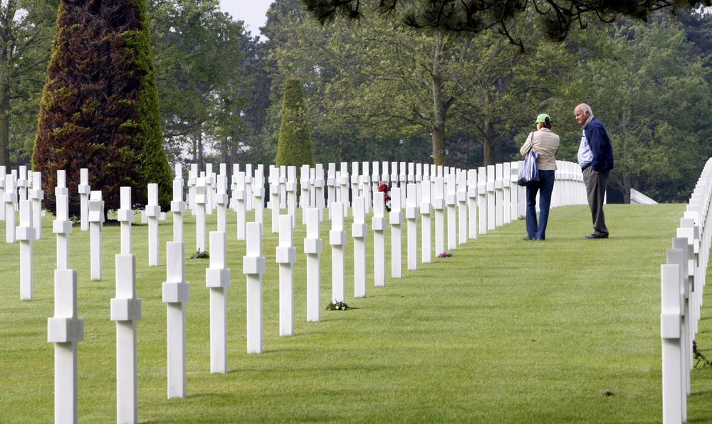 Visitors walk among the graves at the Colleville US cemetery, western France, Sunday  on the 66th anniversary of the D-Day. (AP Photo/Remy de la Mauviniere)