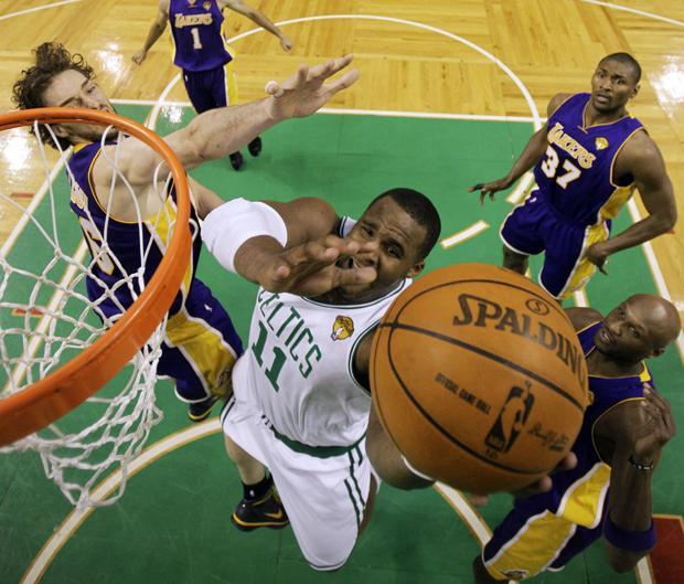 Boston forward Glen Davis drives between Los Angeles&#39; Pau Gasol,  Ron Artest and Lamar Odom during Game 3 of the NBA finals on Tuesday in Boston. The Lakers won 91-84. (AP)