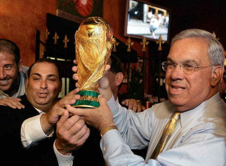 In this October 2006 file photo, Boston Mayor Thomas Menino, right, and restaurateur Nick Varano hoist a replica of the soccer World Cup Trophy at a restaurant in the North End. Nearly three months after Italy defeated France to win the World Cup, a replica of the winner's' trophy came to Boston. (Steven Senne/AP)