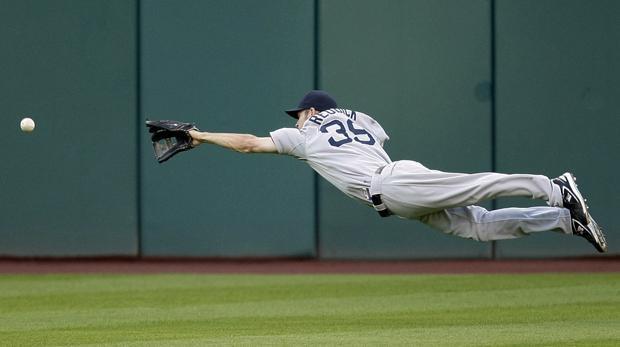 Boston center fielder Josh Reddick dives for a triple hit by Cleveland's Trevor Crowe in the third inning of the game on Wednesday in Cleveland. (AP)