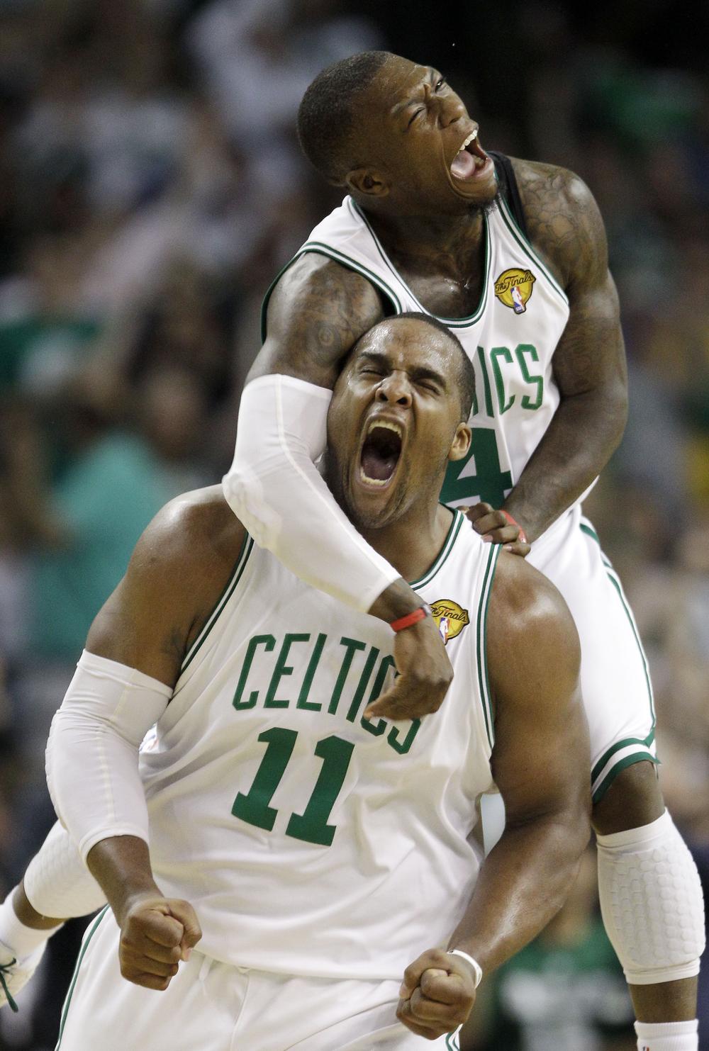 Boston Celtics forward Glen Davis and guard Nate Robinson, rear, celebrate a scoring run against the Los Angeles Lakers during Game 4 of the NBA Finals Thursday. (AP)