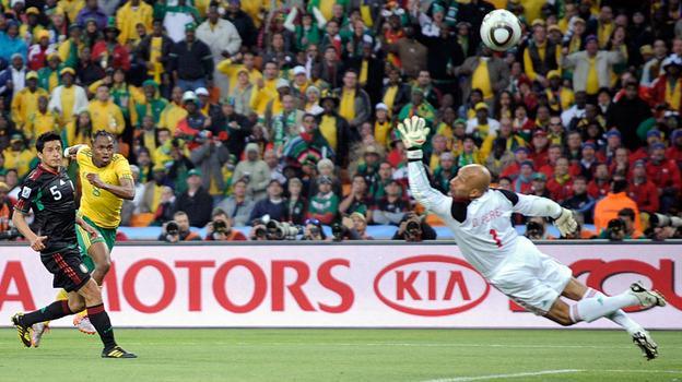 Mexico goalkeeper Oscar Perez fails to block the opening goal by South Africa&#39;s Siphiwe Tshabalala, second from left, during the World Cup opening match between South Africa and Mexico in Johannesburg, South Africa. (AP)