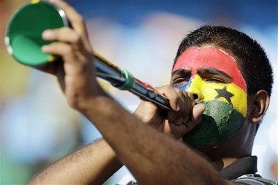 A soccer fan blows the vuvuzela prior to the World Cup soccer match between Serbia and Ghana in Pretoria, South Africa. (AP)