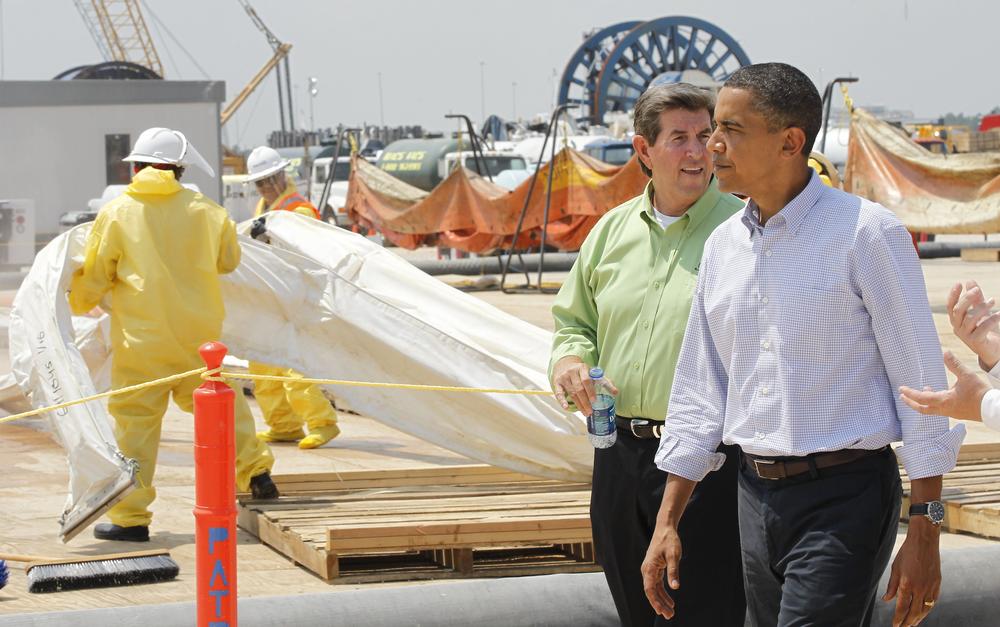 President Obama walks with Alabama Gov. Bob Riley as oil containment booms are cleaned at the Theodore Staging Facility in Theodore, Ala., on Monday. (AP)