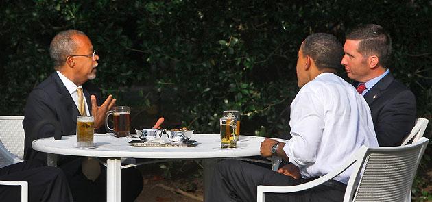 The arrest of Harvard scholar Henry Louis Gates Jr., left, sparked a national debate about race and the police. In this July 30, 2009, file photo, Gates drinks a beer with President Obama and Sgt. James Crowley, the arresting Cambridge police officer. (Alex Brandon/AP)