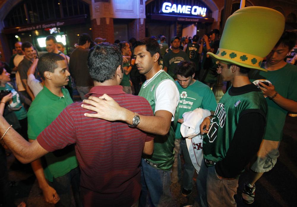 Fans gather outside a bar in Boston early Friday morning, after the LA Lakers beat the Celtics in Game 7 of the NBA finals. (AP)