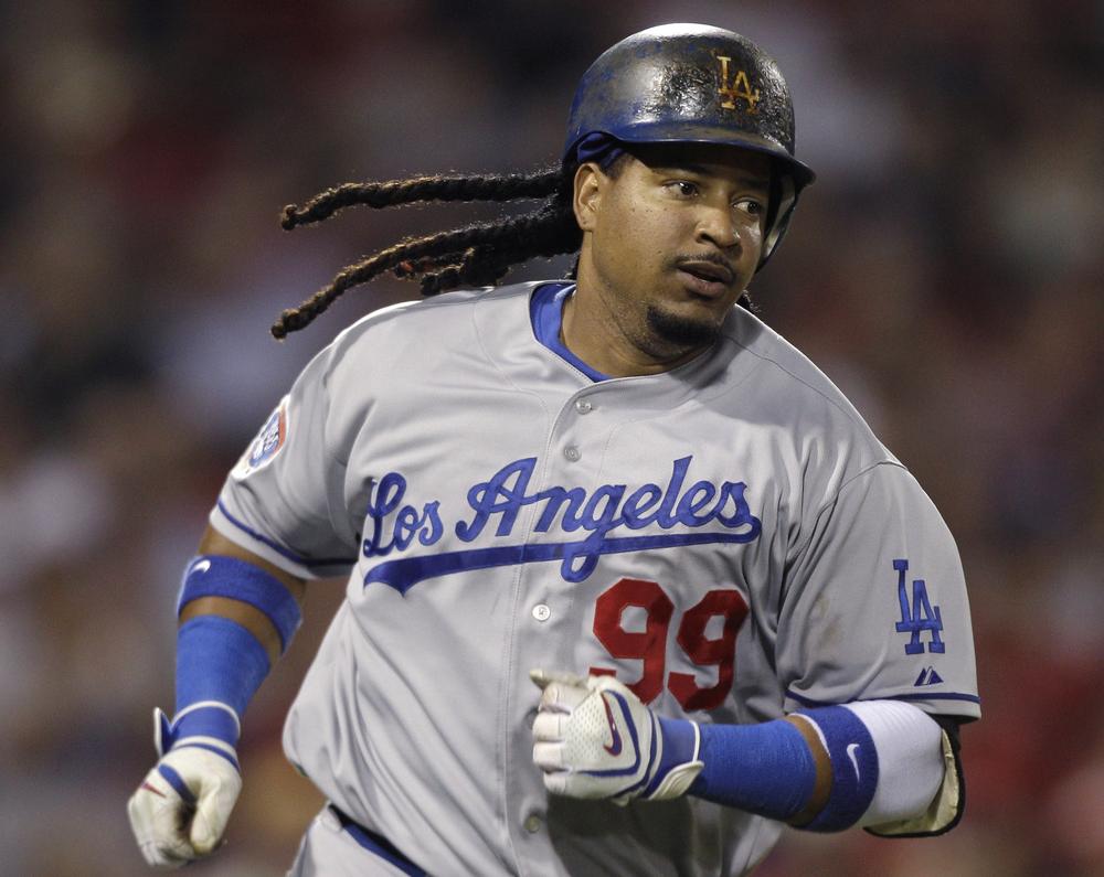 Manny Ramirez runs down the first base line on a single during the sixth inning at Fenway Park , Friday. (AP Photo/Charles Krupa)