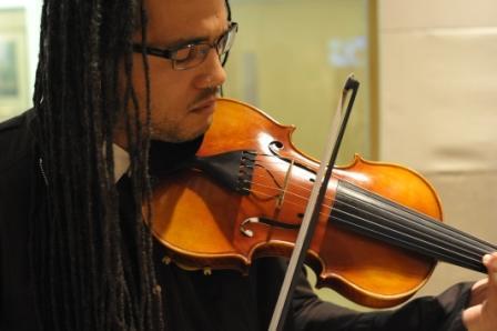 Violinist Daniel Bernard Roumain at WBUR studios in Boston. (Doug Shugarts)