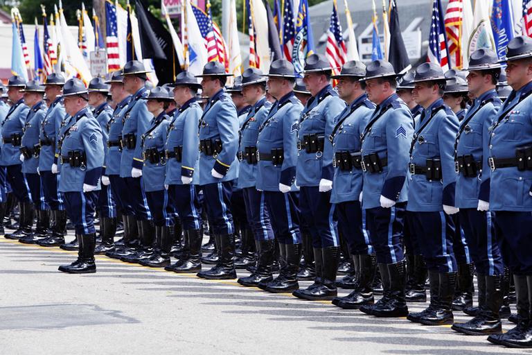 Massachusetts State Police stand at attention during the funeral for State Police Sgt. Doug Weddleton. (AP)