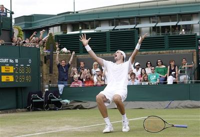 John Isner of the U.S. reacts as he defeats France&#039;s Nicolas Mahut, in their epic men&#039;s singles match at the All England Lawn Tennis Championships at Wimbledon. (AP)