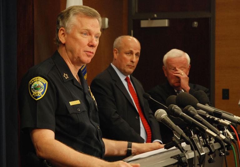 Cambridge Police Commissioner Robert Haas speaks at a news conference about the department&#39;s Gates arrest review on Wednesday. Chuck Wexler, chairman of the review committee, is center. (Jeff Carpenter for WBUR)