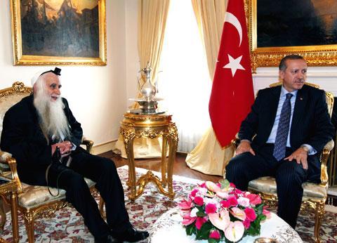 Turkey&#039;s Prime Minister Tayyip Erdogan, right, meets with Israeli cleric and peace activist Menachem Froman in Ankara, Turkey, Thursday, June 3, 2010. (AP)