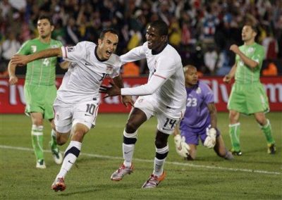 Landon Donovan (left) and Edson Buddle (right) of the USA national soccer team celebrate after Donovan&#039;s game-winning goal against Algeria in Pretoria, South Africa, Wednesday June 23, 2010 (AP Photo/Elise Amendola) 