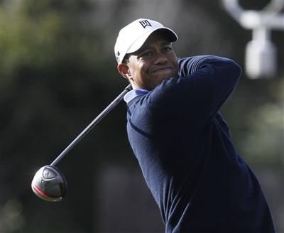 Tiger Woods hits a tee shot during a practice round for the U.S. Open golf tournament Wednesday at the Pebble Beach Golf Links. (AP Photo/Chris Carlson) 