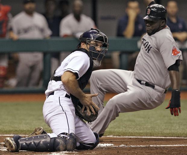 Boston's David Ortiz slides in ahead of the tag by Tampa Bay catcher John Jaso during the third inning of the game on Monday in St. Petersburg, Fla. Ortiz scored on a triple by teammate Kevin Youkilis. (AP)