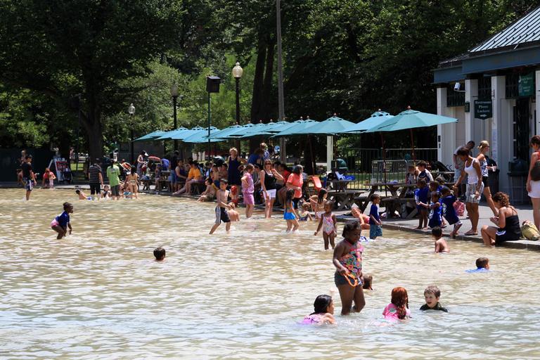 Children cooled off in Boston Common&#39;s Frog Pond Tuesday. (Jeff Carpenter for WBUR)