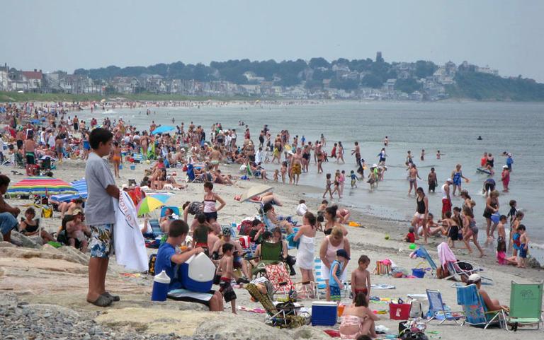 A busy summer day on a beach in Hull. (Fred Thys/WBUR)