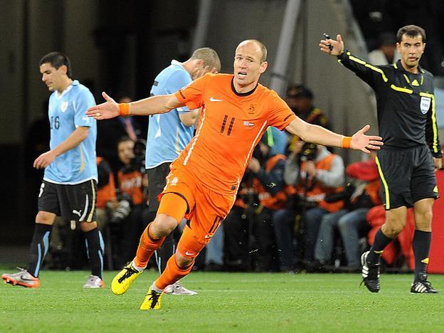 The Netherlands' Arjen Robben celebrates after his second-half goal gave the Dutch a 3-1 lead over Uruguay. (AP)
