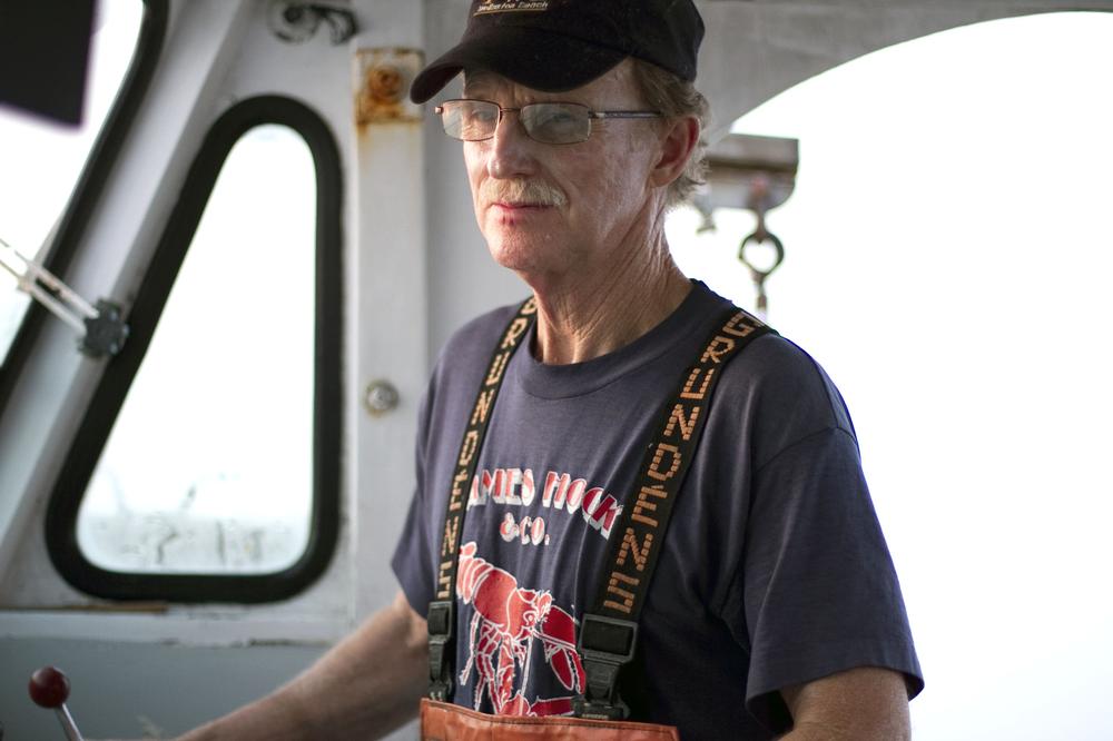 Sixty-eight-year-old Skip Ryan has been catching lobster on Boston Harbor for almost 50 years. (Jess Bidgood for WBUR)