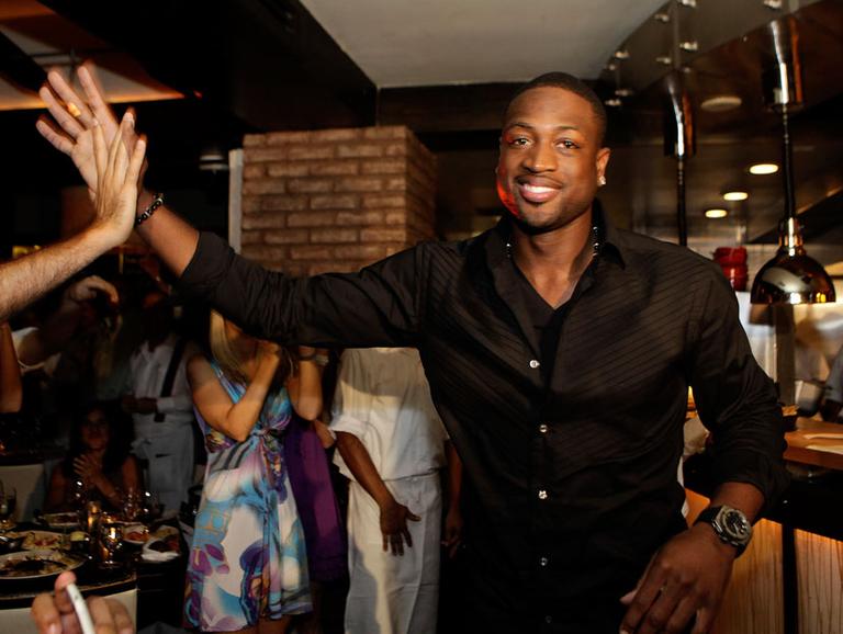 Dwyane Wade is all smiles now that &quot;The King&quot; is heading to South Beach. (AP)