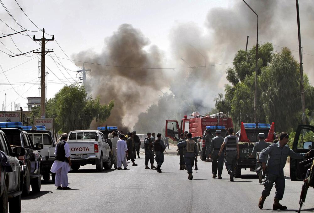 Smoke comes out from the scene of an explosion in Kandahar south of Kabul, Afghanistan on Saturday. One bystander was killed when the bomb, concealed in a parked motorcycle, exploded in the middle of the afternoon, said  the city's security chief. (AP Photo/Allauddin Khan)