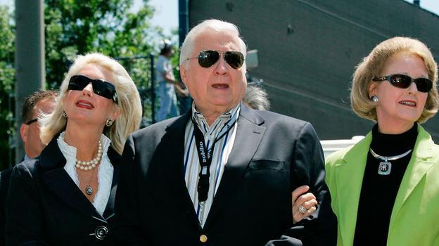 In this March 27, 2008 file photo, New York Yankees senior vice president for new stadium public affairs Jennifer Steinbrenner Swindal, left, holds onto her father and Yankees principal owner George Steinbrenner, center, along with his wife, Joan, during a pregame ceremony renaming Legends Field to George M. Steinbrenner Field at spring training baseball, in Tampa, Fla. (AP)