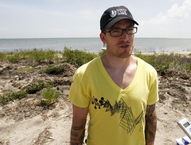 Boston Bruins&#39; defenseman Andrew Ference talks with reporters during a tour of oil damaged areas near Barataria Bay, La., on Tuesday. (AP)