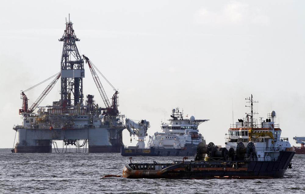 Vessels assisting in the capping of the Deepwater Horizon oil wellhead are seen on the Gulf of Mexico near the coast of Louisiana Friday. (AP)