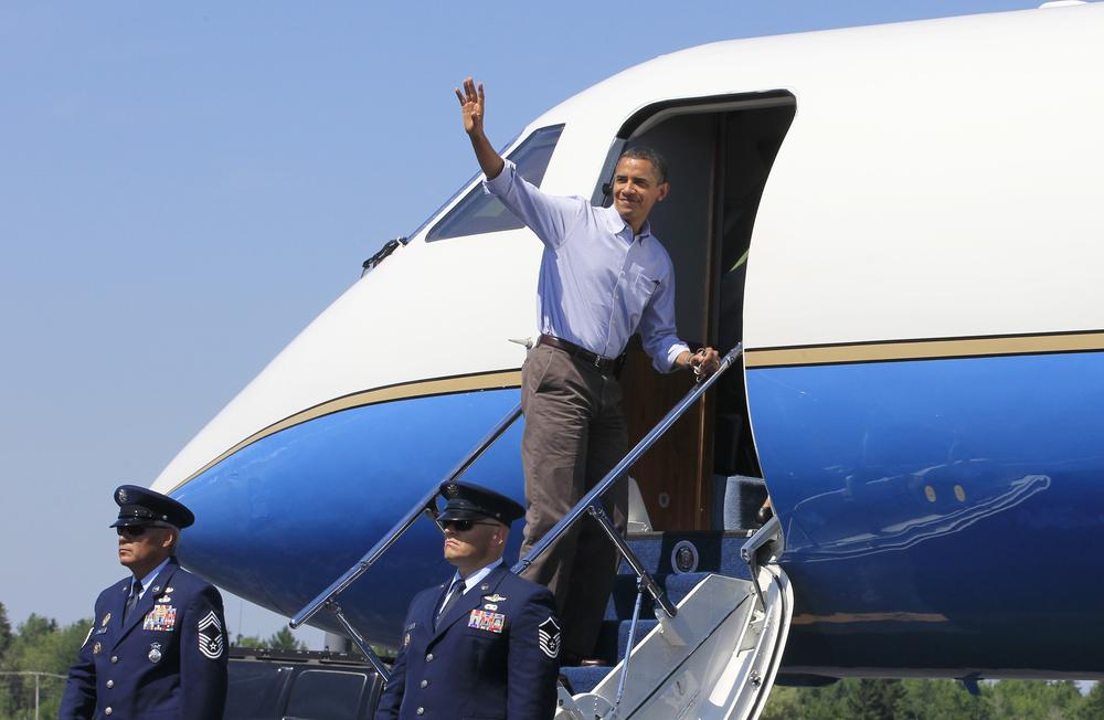 President Obama boards Air Force One at Hancock County Bar Harbor Airport in Trenton, Maine, on Sunday. (AP)