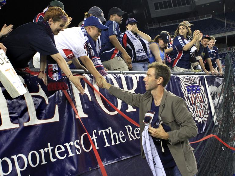 New England Revolution's Steve Ralston shakes hands with fans after announcing his retirement after a soccer match against Monarcas Morelia at Gillette Stadium on Tuesday. (AP)