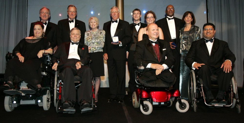 Former President George H.W. Bush with recipients of the George Bush Medal for the Empowerment of People with Disabilities in 2005. (Haraz N. Ghanbari/AP)
