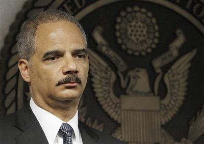 Attorney General Eric Holder looks on during a news conference in Miami in July.  (AP )