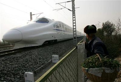 An elderly man watches the testing of a high speed train in front of his house in Xinping, in China&#039;s Shaanxi province in 2006.  (AP)
