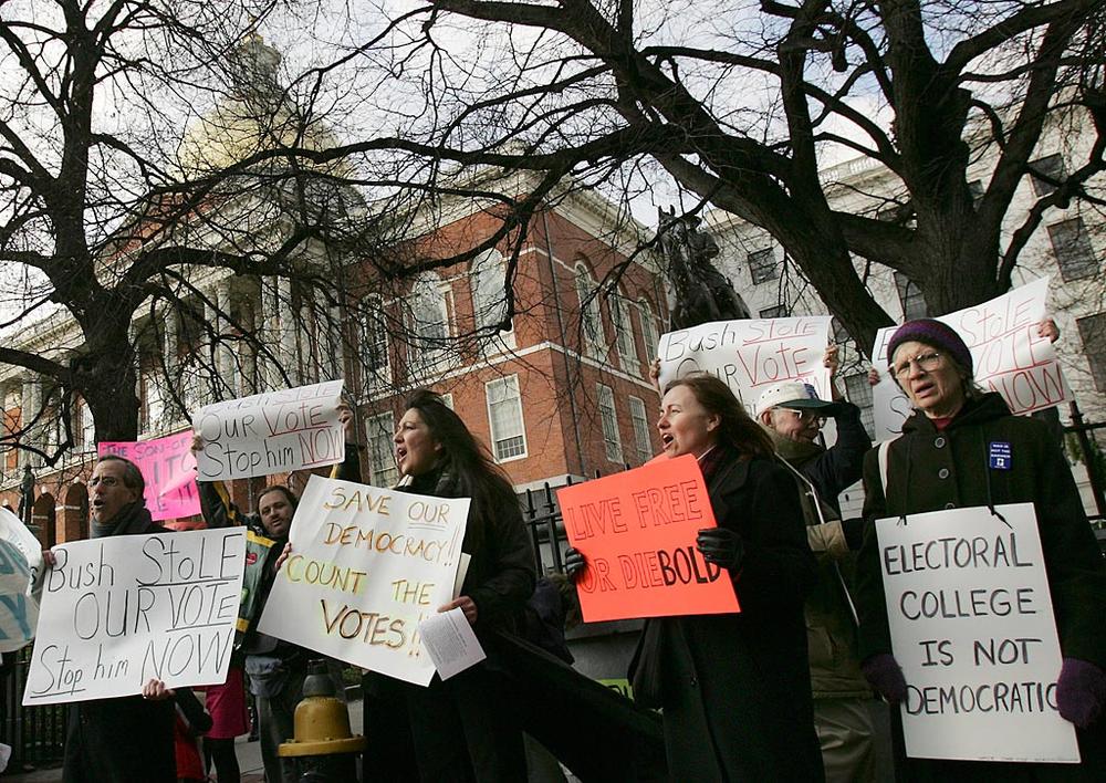 In December 2004, as the state's Electoral College members were sworn in at the State House, protesters outside demonstrated their opposition to the system. (Michael Dwyer/AP)
