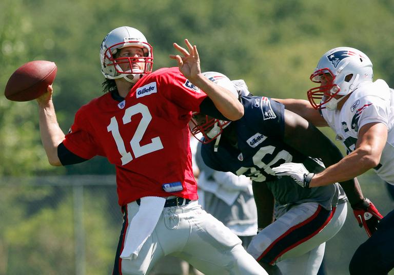 New England Patriots quarterback Tom Brady throws the ball in a scrimmage at training camp on Friday. (AP)
