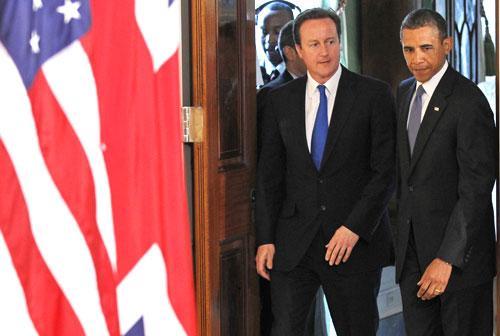 Pres. Barack Obama and British Prime Minister David Cameron arrive for a joint news conference at the White House, July 20, 2010. (AP)