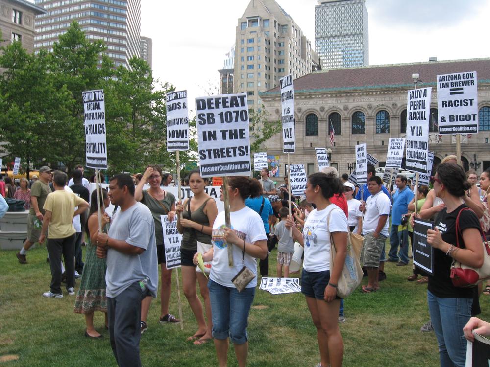 Immigration advocates protest in Copley Square. (Sacha Pfeiffer/WBUR)