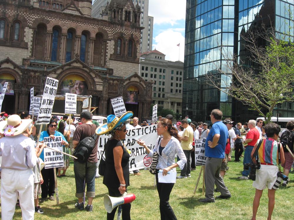 Immigration advocates protest in Copley Square. (Sacha Pfeiffer/WBUR)
